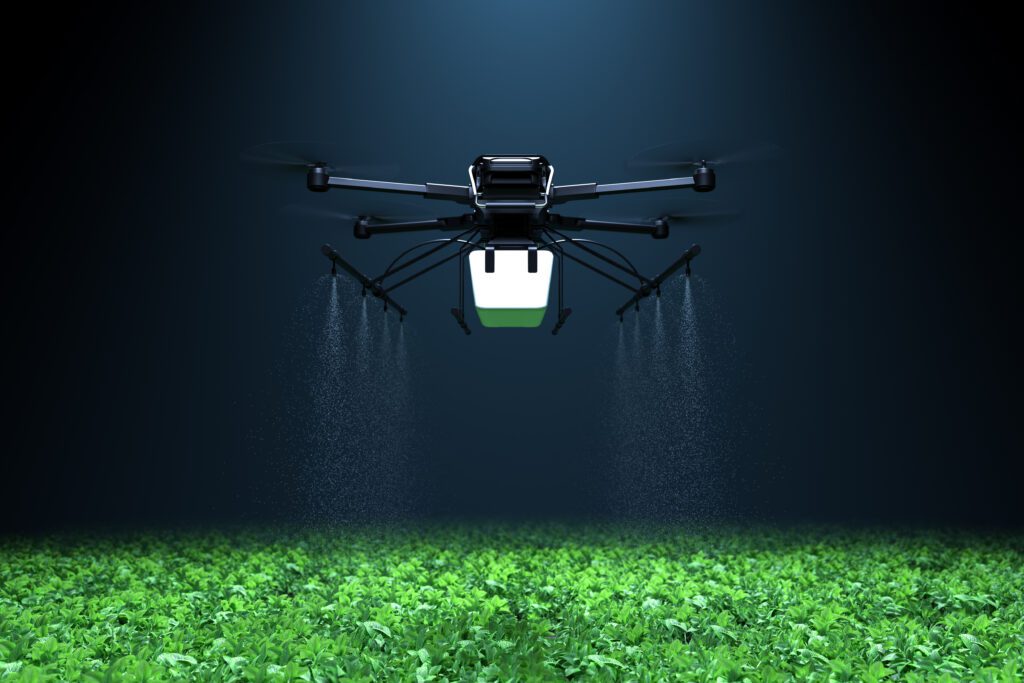 Drone spraying fertilizer on vegetable crops