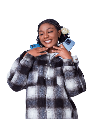 Smiling person holding two smartphones, expressing digital empowerment in a tech-driven lifestyle